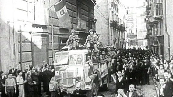 American troops enter an Italian town shortly after landing at Salerno